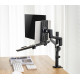 UVI black laptop and tablet tray attached to a VESA monitor arm, shown holding a laptop with adjustable depth and height settings