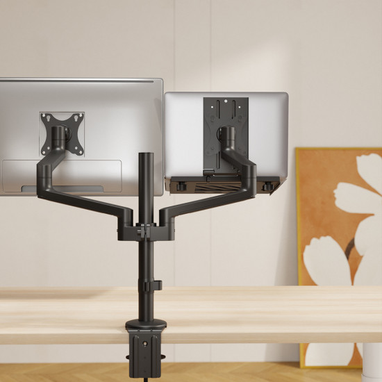 UVI black laptop and tablet tray attached to a VESA monitor arm, shown holding a laptop with adjustable depth and height settings