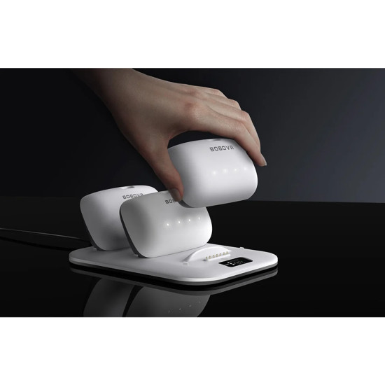 BOBOVR BD3 charging station with three B100 batteries docked, digital display showing charge levels and power output
