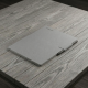 reMarkable Paper Pro + Marker Plus + Book Folio Gray reMarkable Paper Pro tablet in Polymer Weave Gray with Marker Plus stylus and Book Folio cover, open and viewed from above on a desk