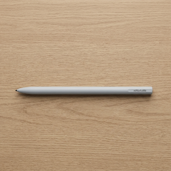 reMarkable 2 Marker stylus in white with slim matte finish, shown next to the reMarkable 2 tablet on a white background