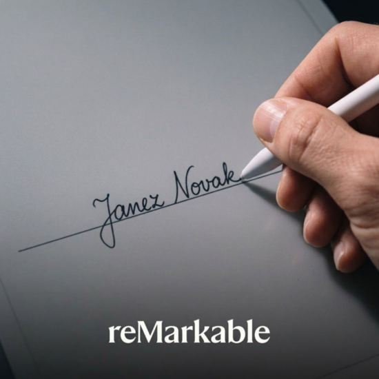 reMarkable 2 Marker stylus in white with slim matte finish, shown next to the reMarkable 2 tablet on a white background