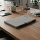 reMarkable Paper Pro Move + Marker Plus + Book Folio Grey reMarkable Paper Pro Move digital paper tablet with Marker Plus stylus and grey Book Folio cover, open on a desk